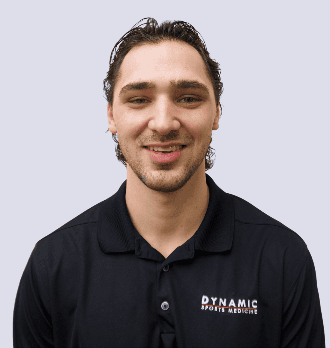 Portrait of a sports medicine specialist smiling in professional attire.