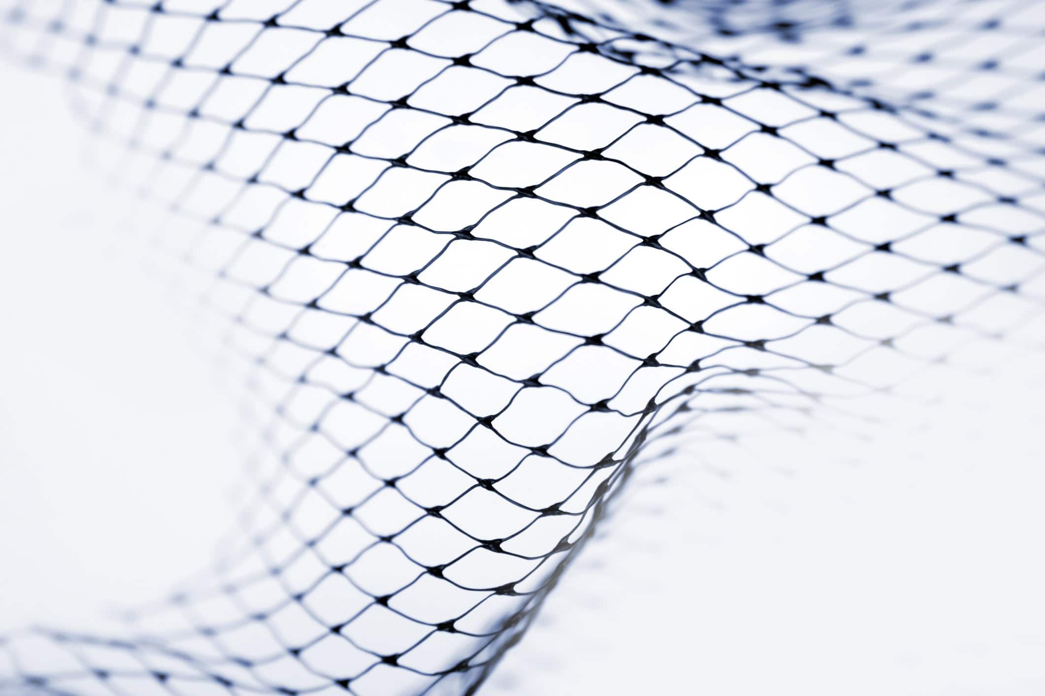 Close-up of a sports injury mesh net, used in sports medicine for bracing or support during recovery and rehabilitation. Ideal for promoting healing and preventing further injury in athletes.