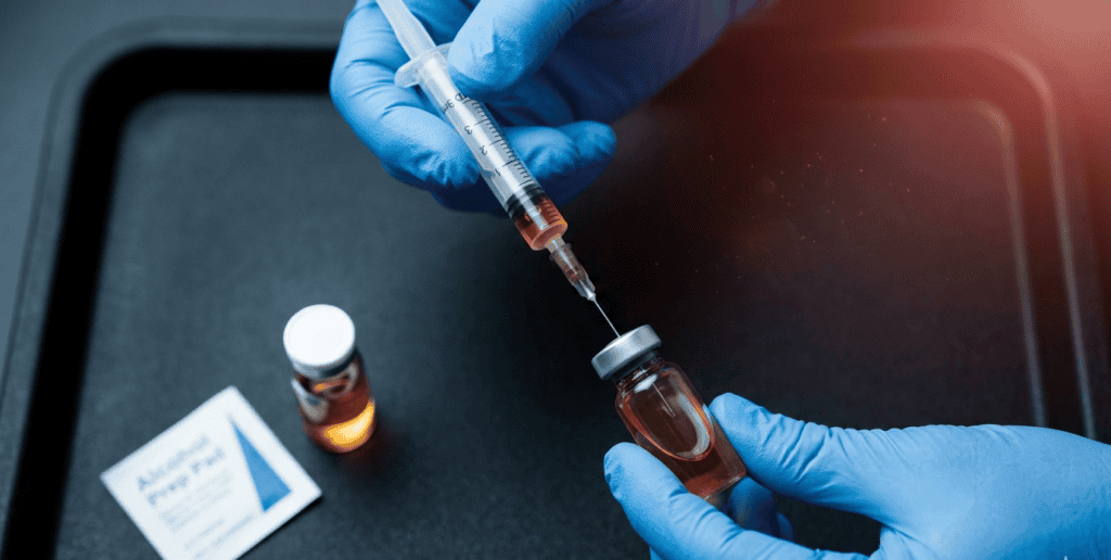 A healthcare professional prepares a BPC-157 injection to promote injury healing and recovery, highlighting innovative sports medicine treatments.