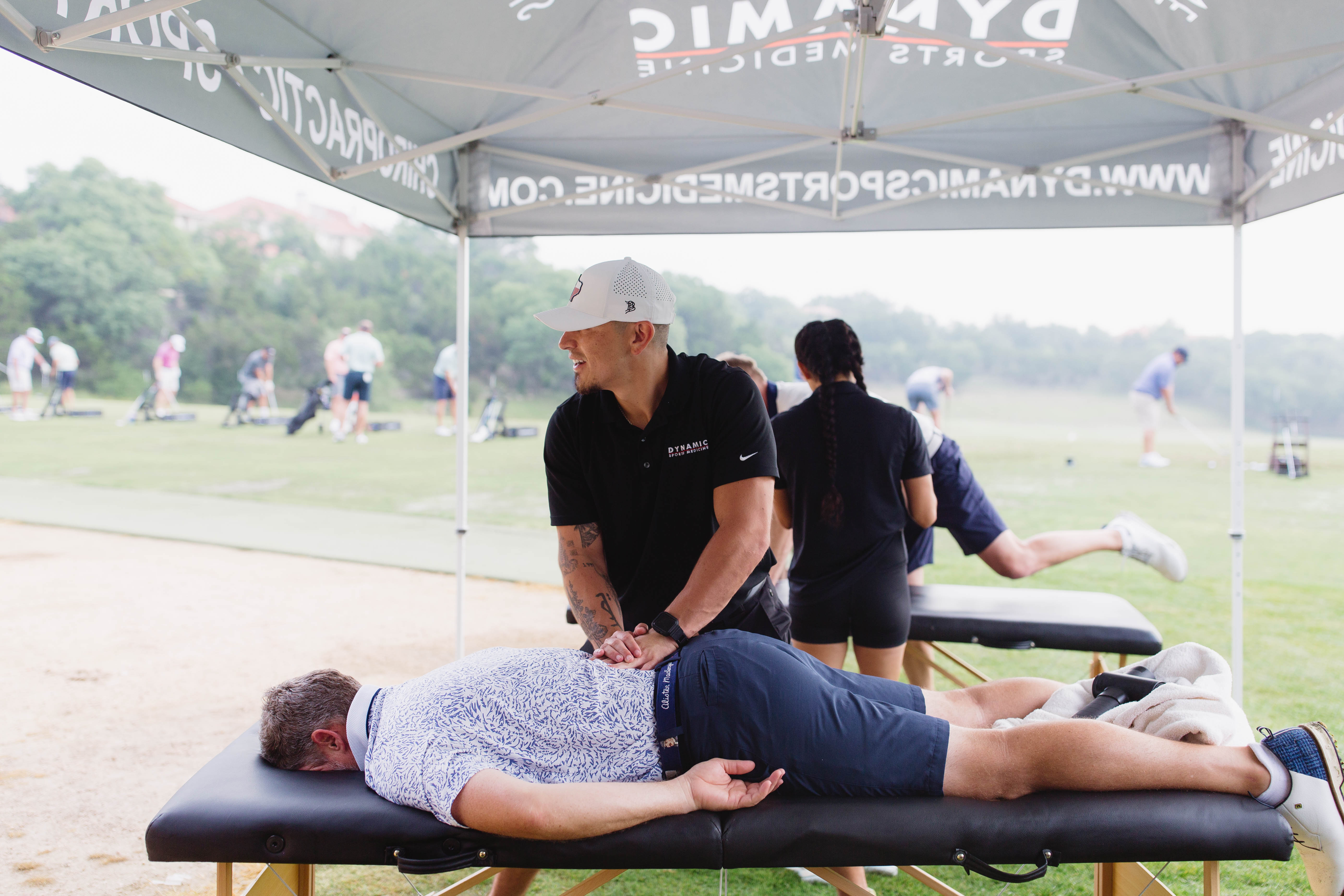 Sports chiropractor treating member