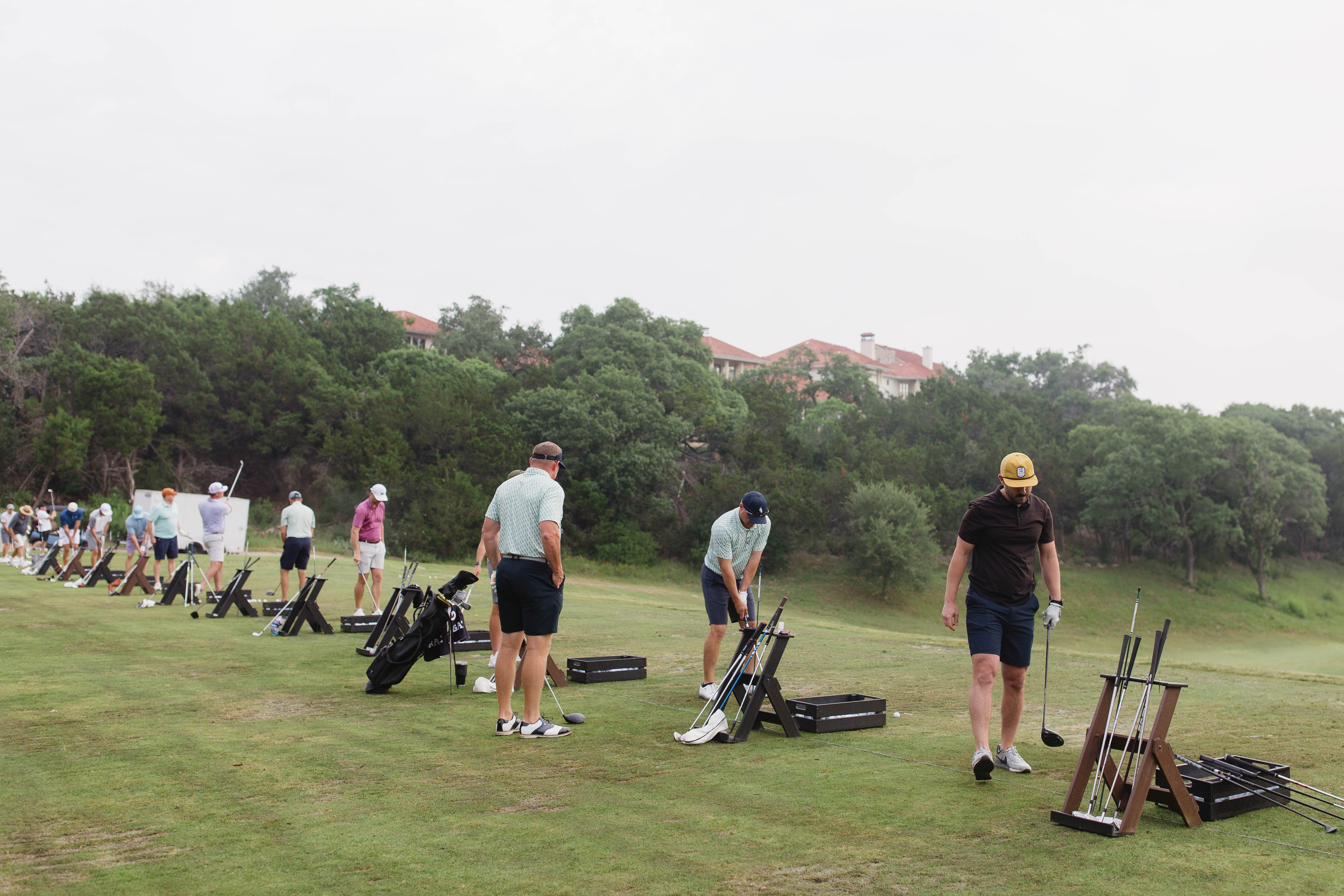 Golfers on the driving range at country club event