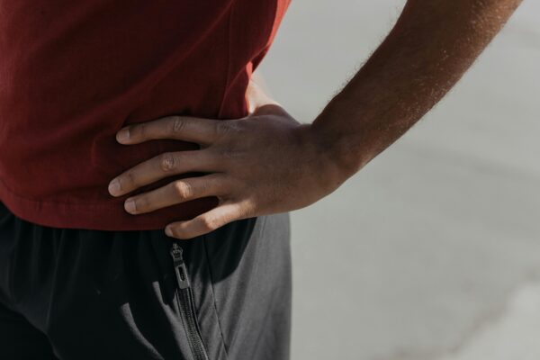 Male athlete experiencing groin pain, seeking specialized sports hernia and athletic pubalgia treatment.