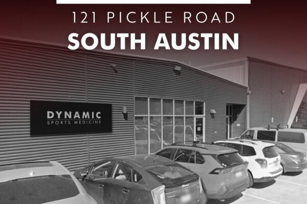 Exterior view of Dynamic Sports Medicine clinic in South Austin with parking lot and signage, announcing upcoming opening at 121 Pickle Road.