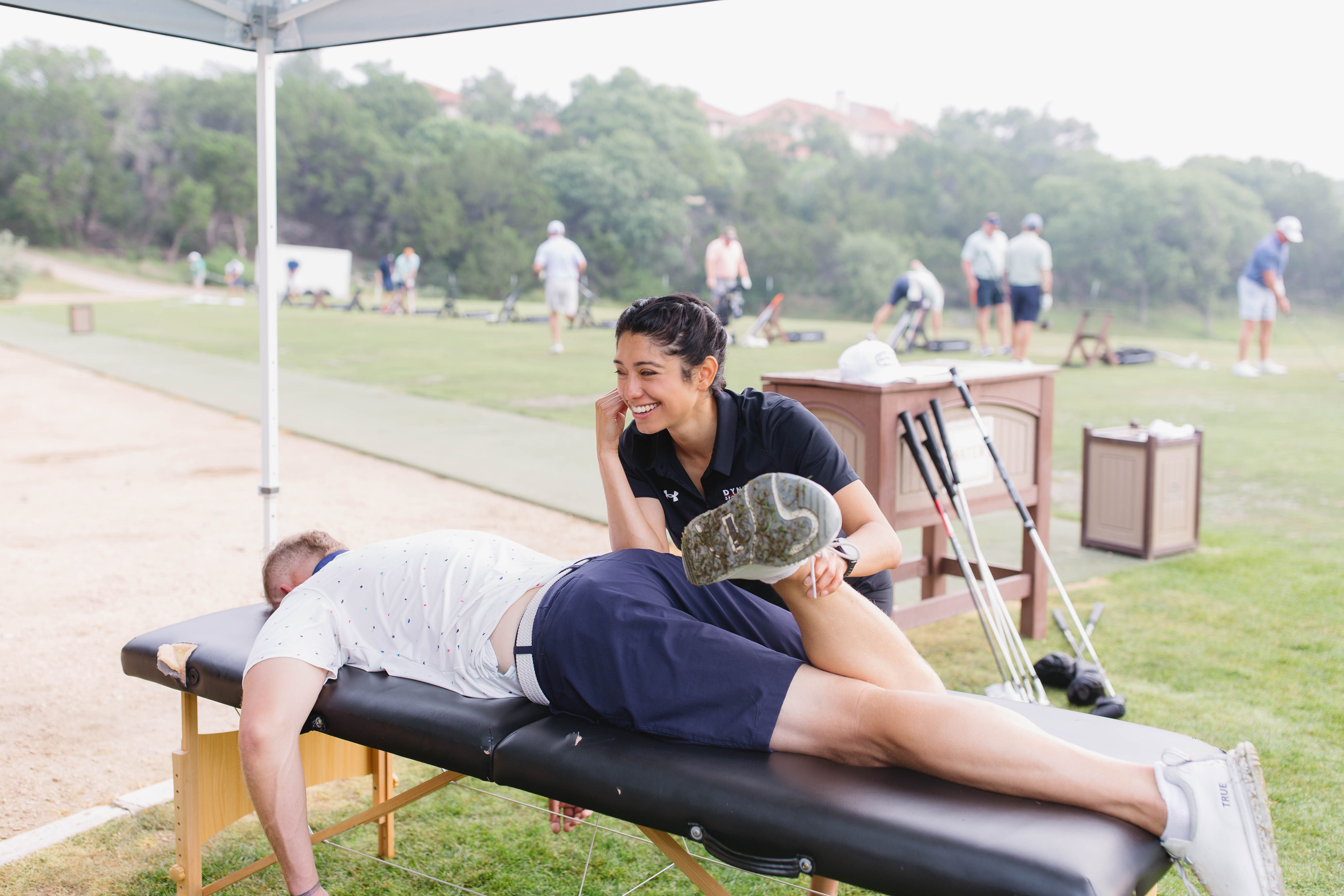 Practitioner treating member with a smile